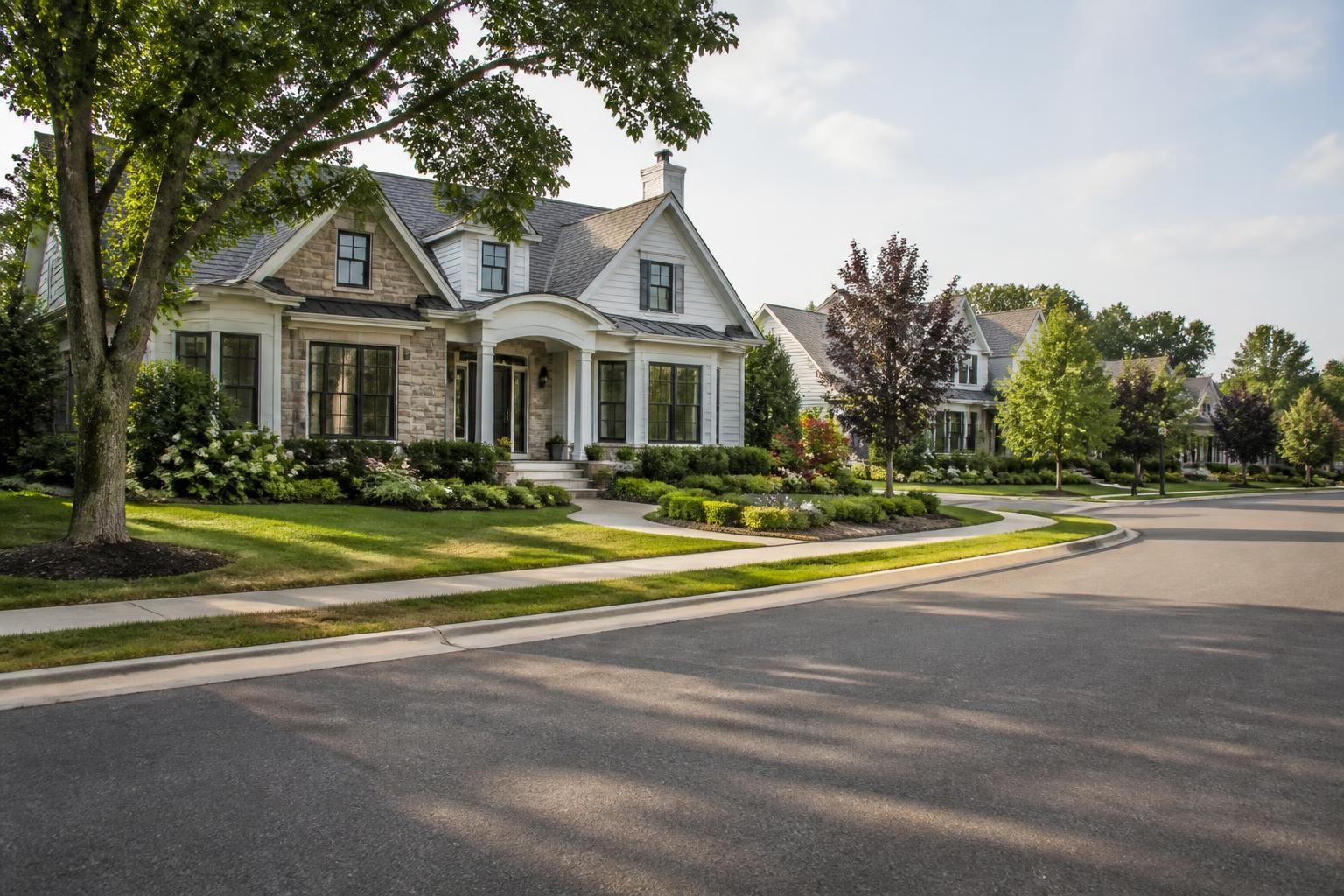 Upscale suburban neighborhood with polished homes and landscaping.